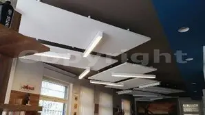 Esempio reale di correzione acustica professionale con isole fonoassorbenti a soffitto<br /><br />
